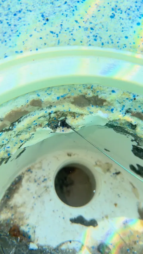 Plaster breaking up around the drain ring.
